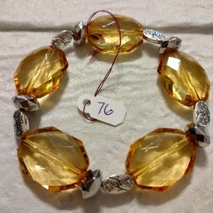 Artemis's Gems custom-made beaded bracelet with metal flower engraved beads